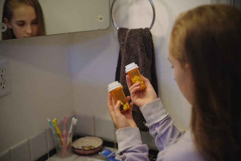 Girl finds prescription drugs in bathroom